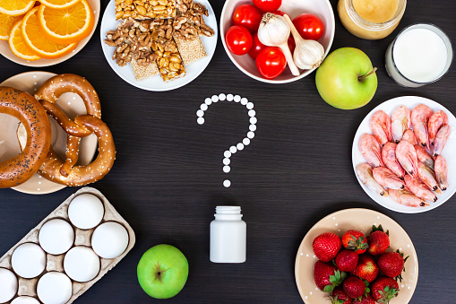 Set of food that cause allergy on wooden table